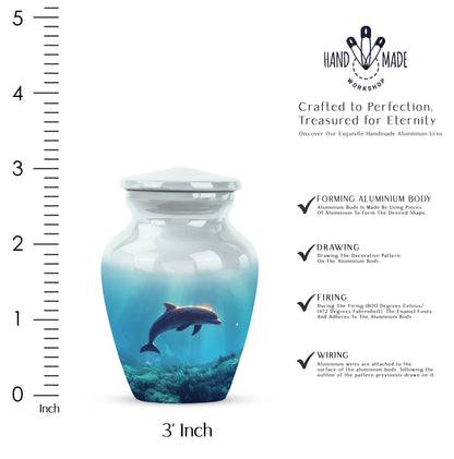 Gleaming Silver Dolphin Cremation Urn close-up of engraving and surface detail - classic sculpted dolphin pattern on smooth aluminum - mini keepsake memorial for portion of cremation ashes