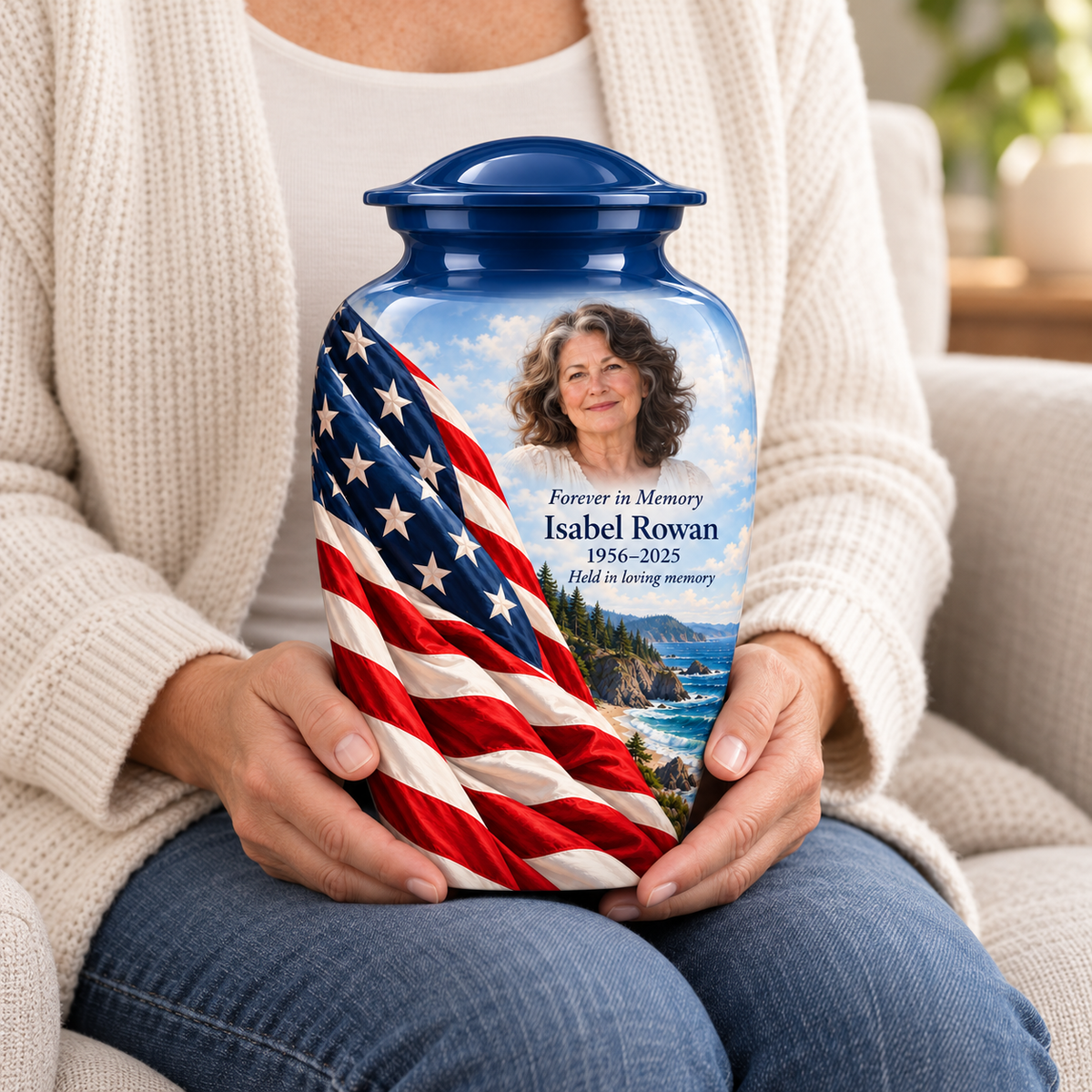 Rocky Coast American flag adult urn with sample photo and text held upright on a seated person’s lap