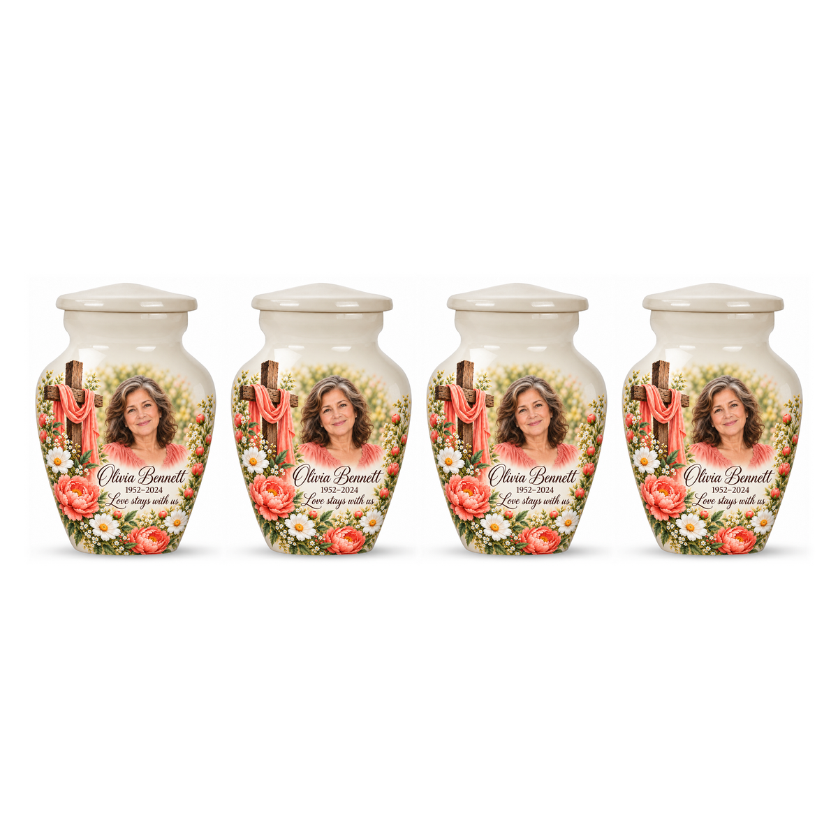 Four matching white cross keepsake urns with coral flowers and white daisies arranged on white.