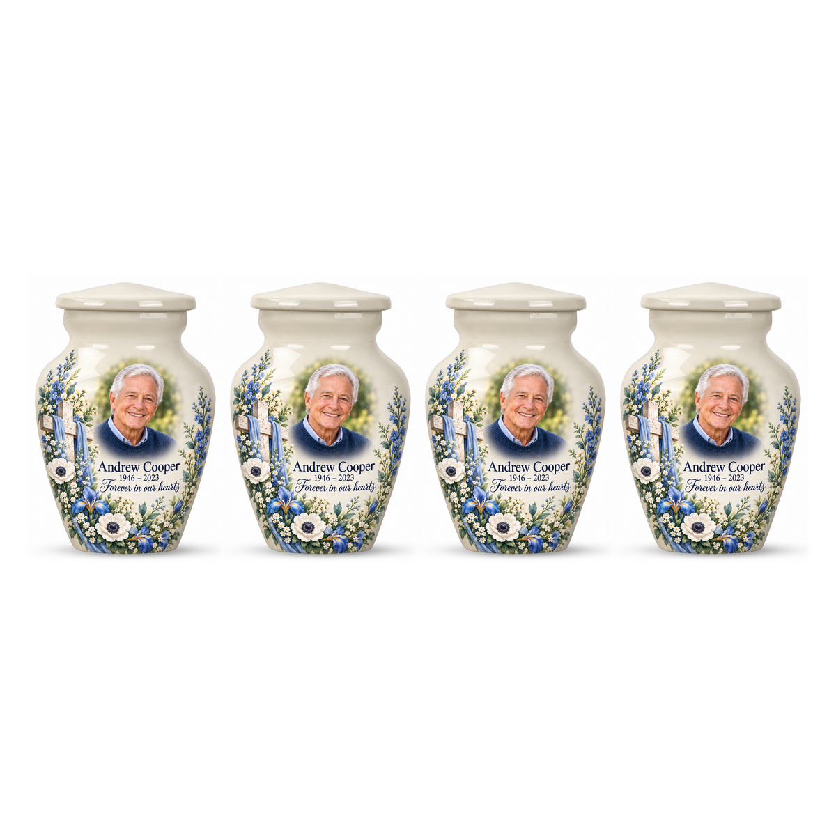 Four matching white cross keepsake urns with blue and white flowers arranged on white.