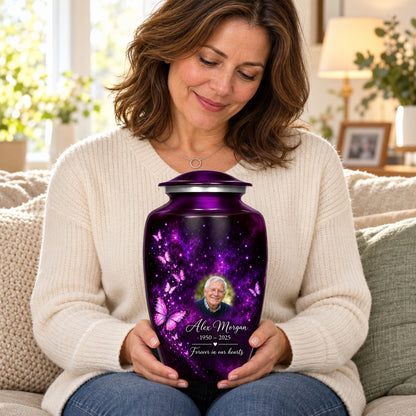 Seated person holding the adult Plum Starlight butterfly urn on their lap.