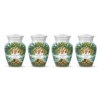 Four matching Emerald Oak Tree of Life keepsake urns with sample photo and text on a white background