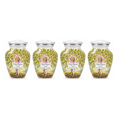 Four matching White Birch Tree of Life keepsake urns with sample photo and text on a white background