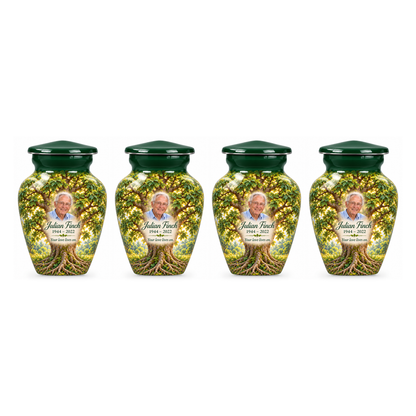 Four matching Green Ash Tree of Life keepsake urns with sample photo and text on a white background