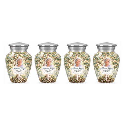 Four matching Silver Aspen Tree of Life keepsake urns with sample photo and text on a white background