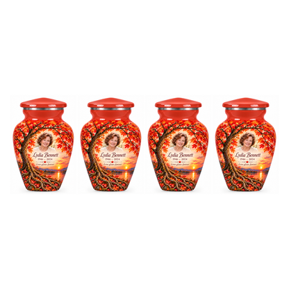Four matching Coral Sunset Maple Tree of Life keepsake urns with sample photo and text on a white background