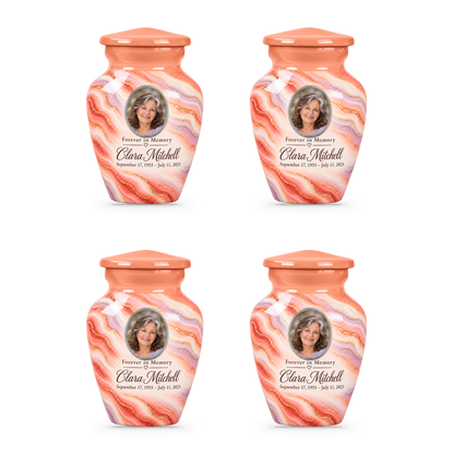 Four matching Sunrise Opal keepsake urns with sample portrait, name and dates.