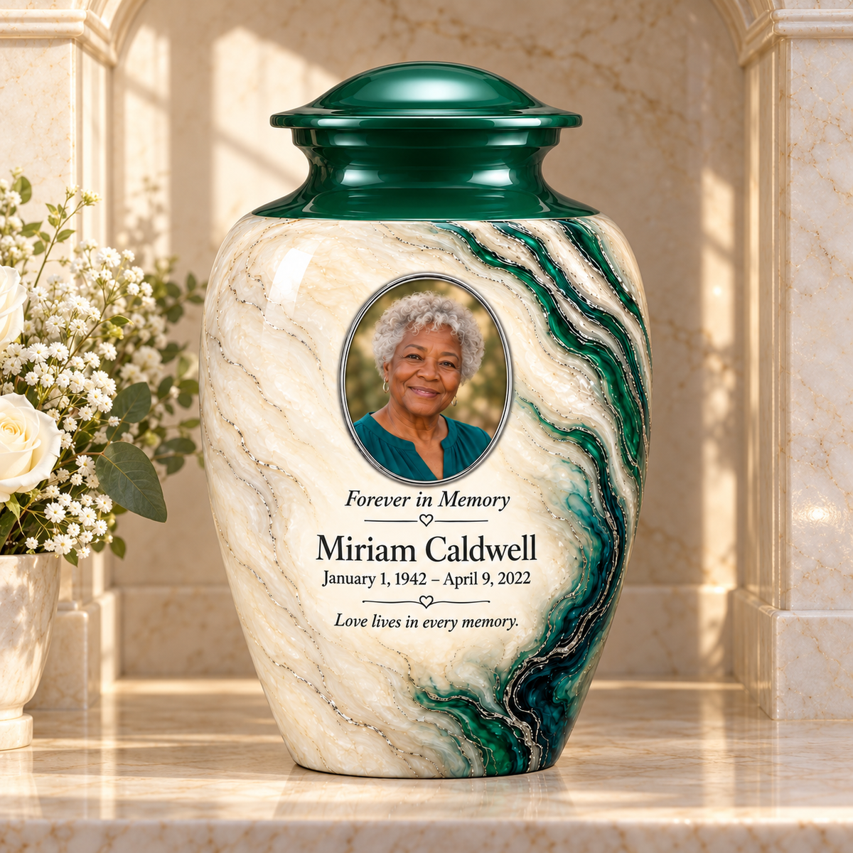 Emerald Estuary personalized adult urn in a stone columbarium niche.