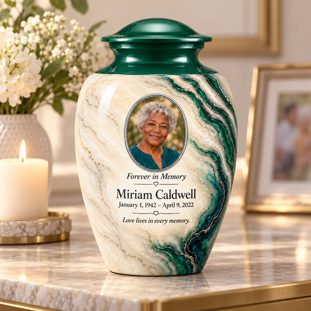 Emerald Estuary adult urn on a memorial console beside a candle and flowers.