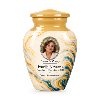 One Saffron Eddy cream, blue and golden keepsake urn with a sample portrait and short tribute.