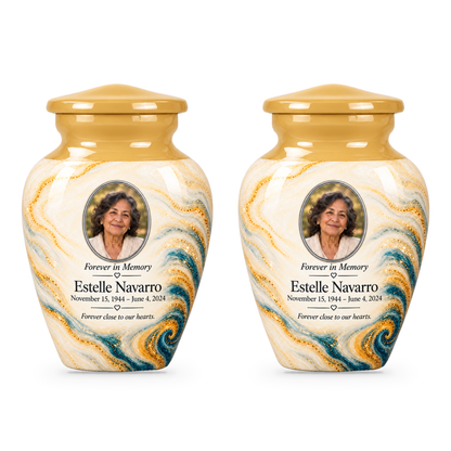 Two matching Saffron Eddy keepsake urns with sample portrait and memorial text.