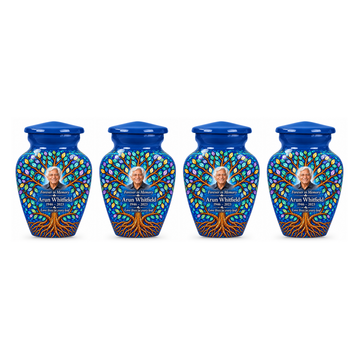 Four matching Cobalt Leaf Mosaic Tree of Life keepsake urns with sample photo and text on a white background