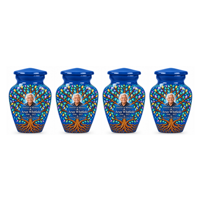 Four matching Cobalt Leaf Mosaic Tree of Life keepsake urns with sample photo and text on a white background