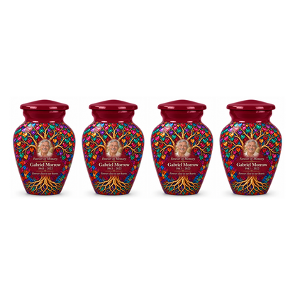 Four matching Burgundy Heart Mosaic Tree of Life keepsake urns with sample photo and text on a white background