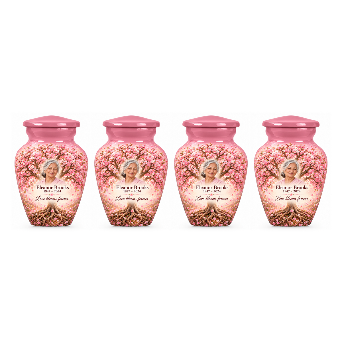 Four matching Pink Cherry Blossom Tree of Life keepsake urns with sample photo and text on a white background