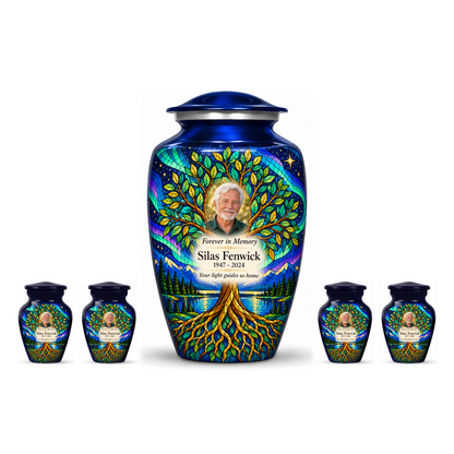 One blue aurora Tree of Life adult urn centered between four matching keepsakes on white, all with Silas Fenwick sample portrait and memorial text.