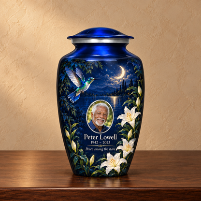 Blue hummingbird adult urn with white lilies, sample photo and text on a memorial console