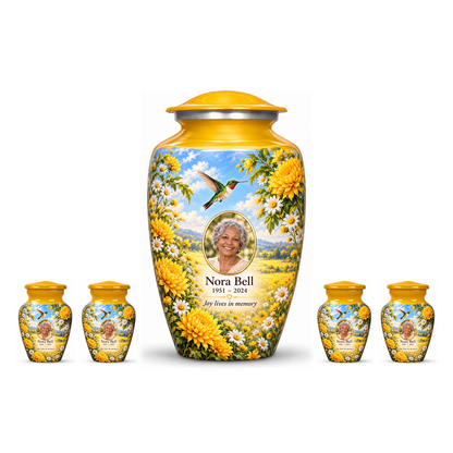 One yellow hummingbird adult urn with four matching keepsakes, all with chrysanthemums, white daisies and Nora Bell sample photo and text