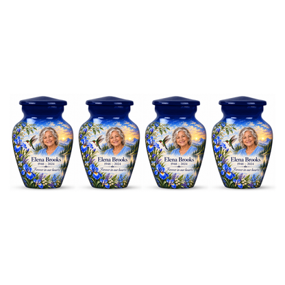 Four matching blue hummingbird keepsake urns with irises, mountain lake and Elena Brooks sample photo and text