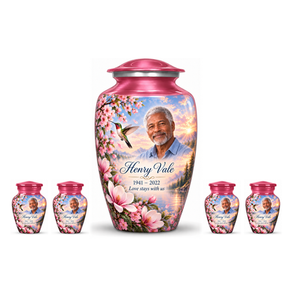 One pink hummingbird adult urn with four matching keepsakes, all with Henry Vale sample photo and text