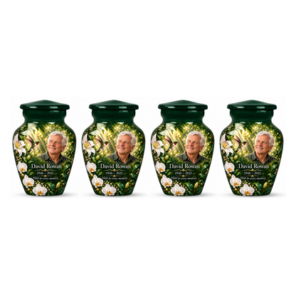 Four matching green hummingbird keepsake urns with David Rowan sample photo and text