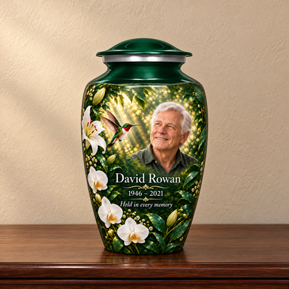 Green hummingbird adult urn with David Rowan sample photo and text displayed on a memorial console