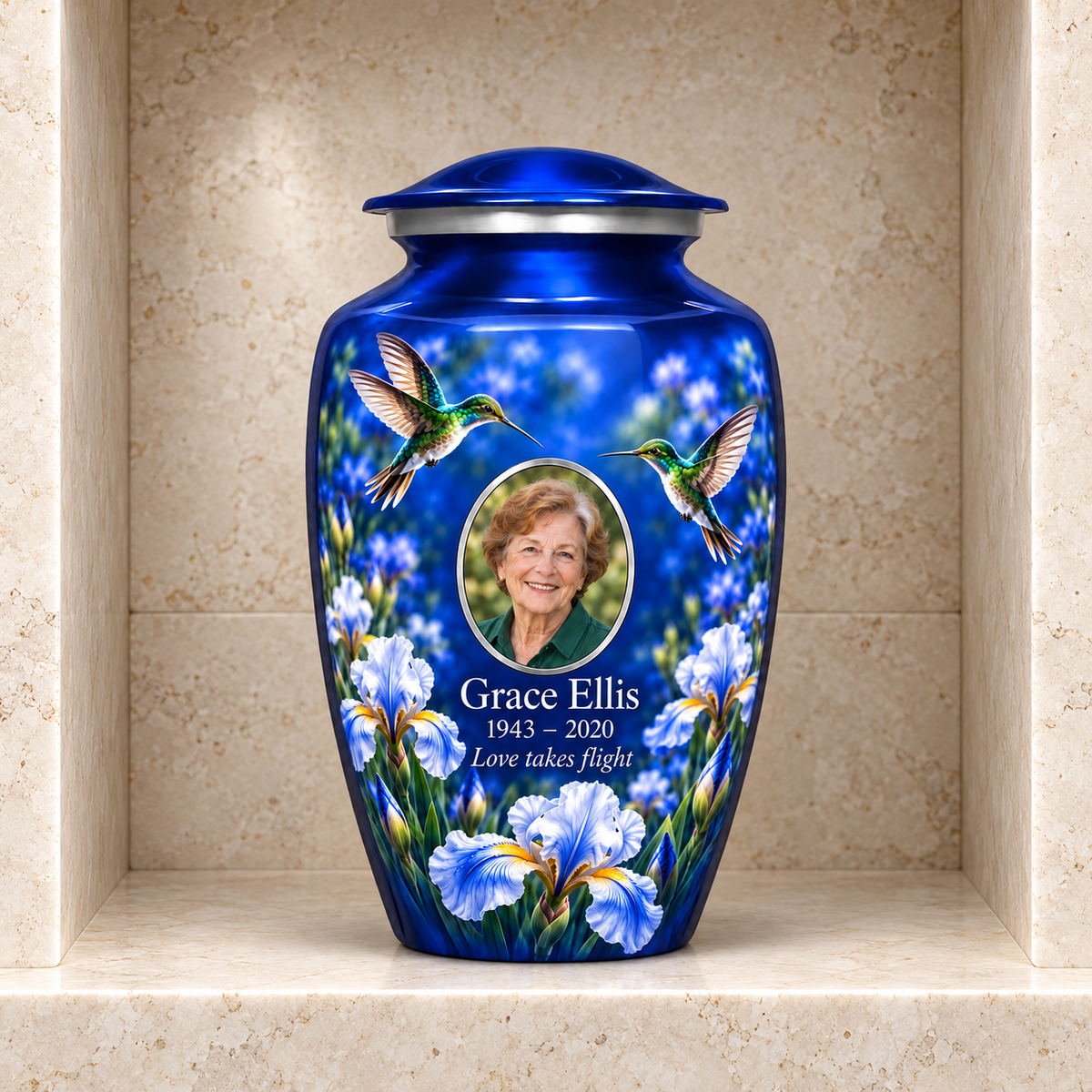 Blue hummingbird adult urn with Grace Ellis sample photo and text displayed in a stone columbarium niche