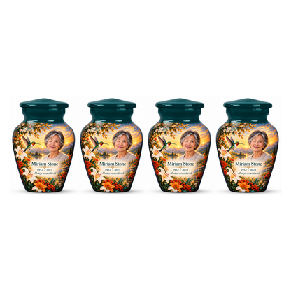Four matching green hummingbird keepsake urns with Miriam Stone sample photo and text