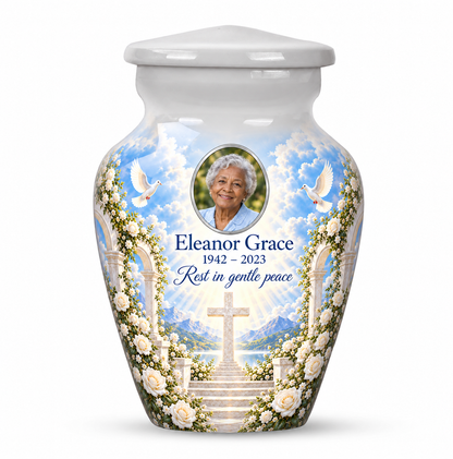One white cross keepsake urn with white roses and garden steps, sample portrait and tribute on white.