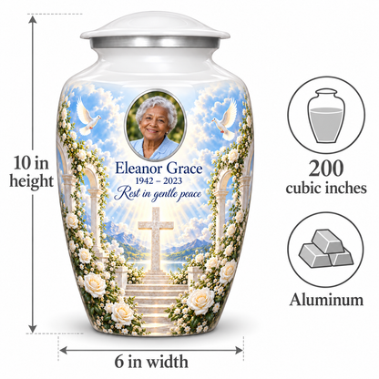 White cross urn size guide: adult height 10 inches, width 6 inches and capacity 200 cubic inches.