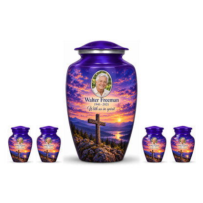 One purple adult cross urn and four keepsakes with purple mountain twilight arranged on white.