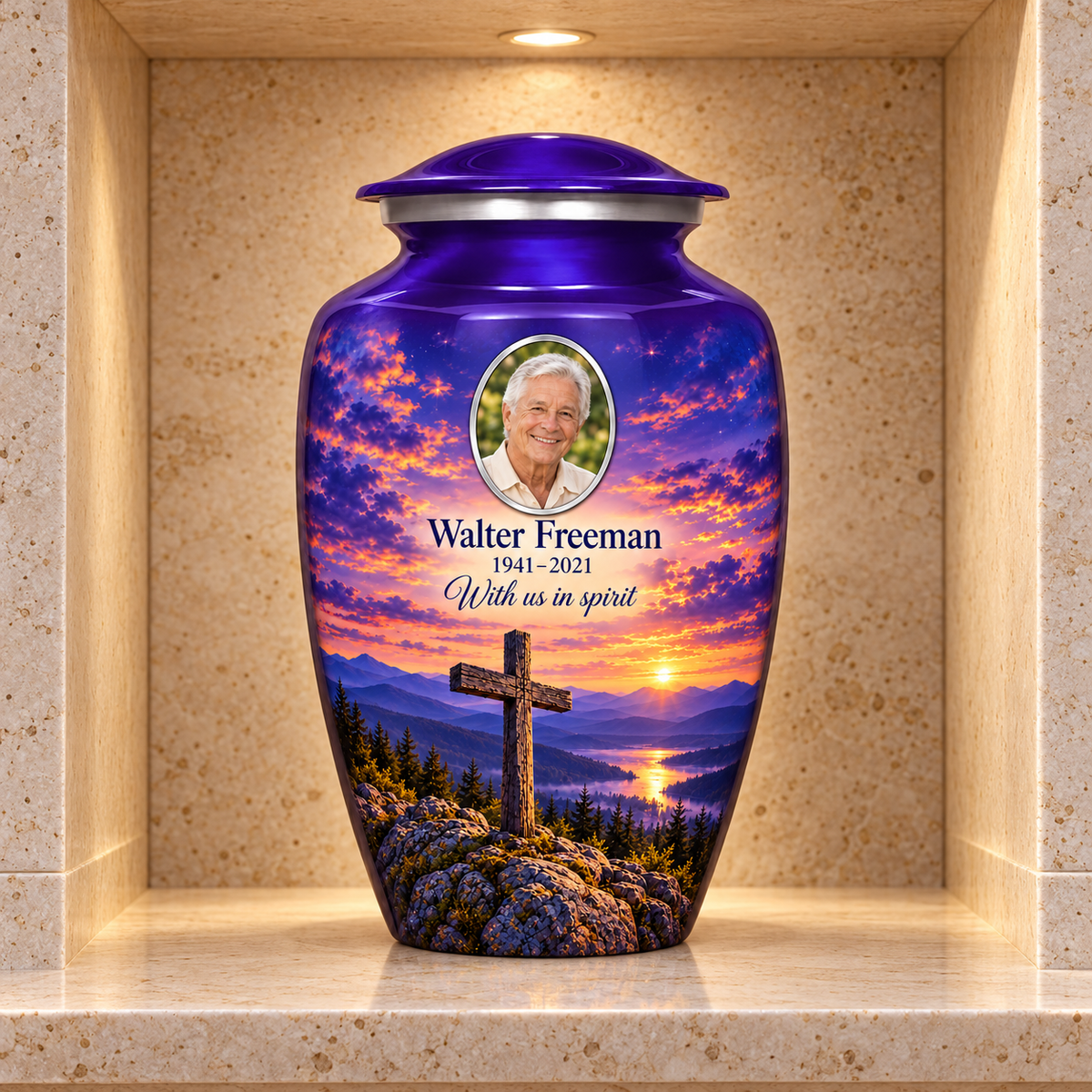 Purple adult cross urn with purple mountain twilight displayed in a stone columbarium niche.