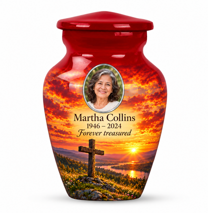 One red cross keepsake urn with a red meadow sunset, sample portrait and tribute on white.