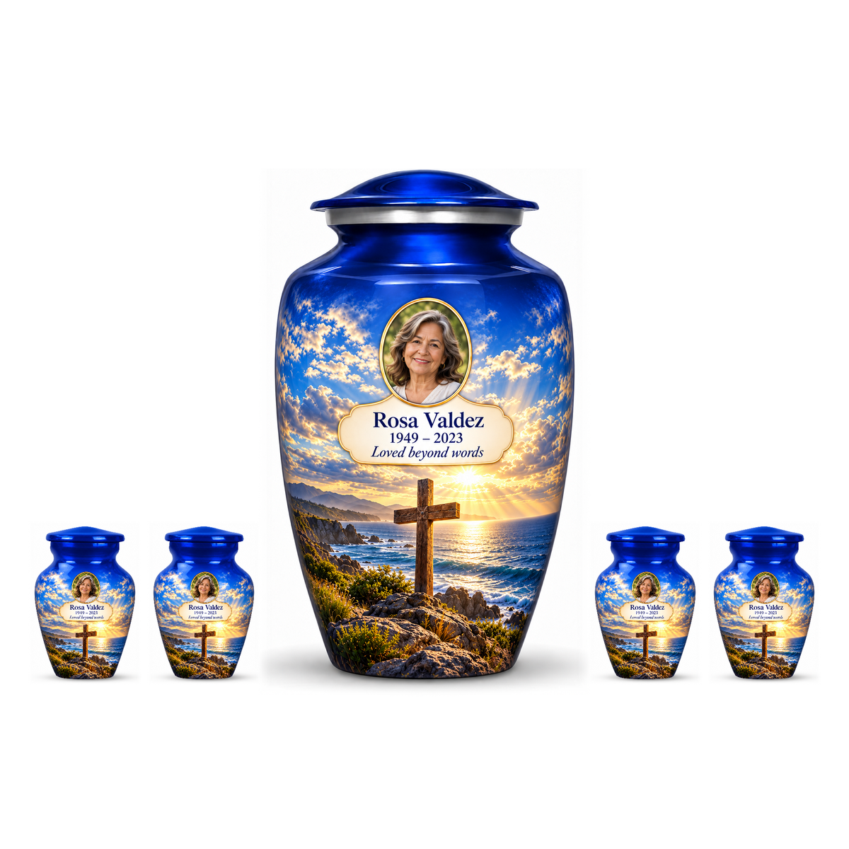 One blue adult cross urn and four keepsakes with a blue coastal sunset arranged on white.