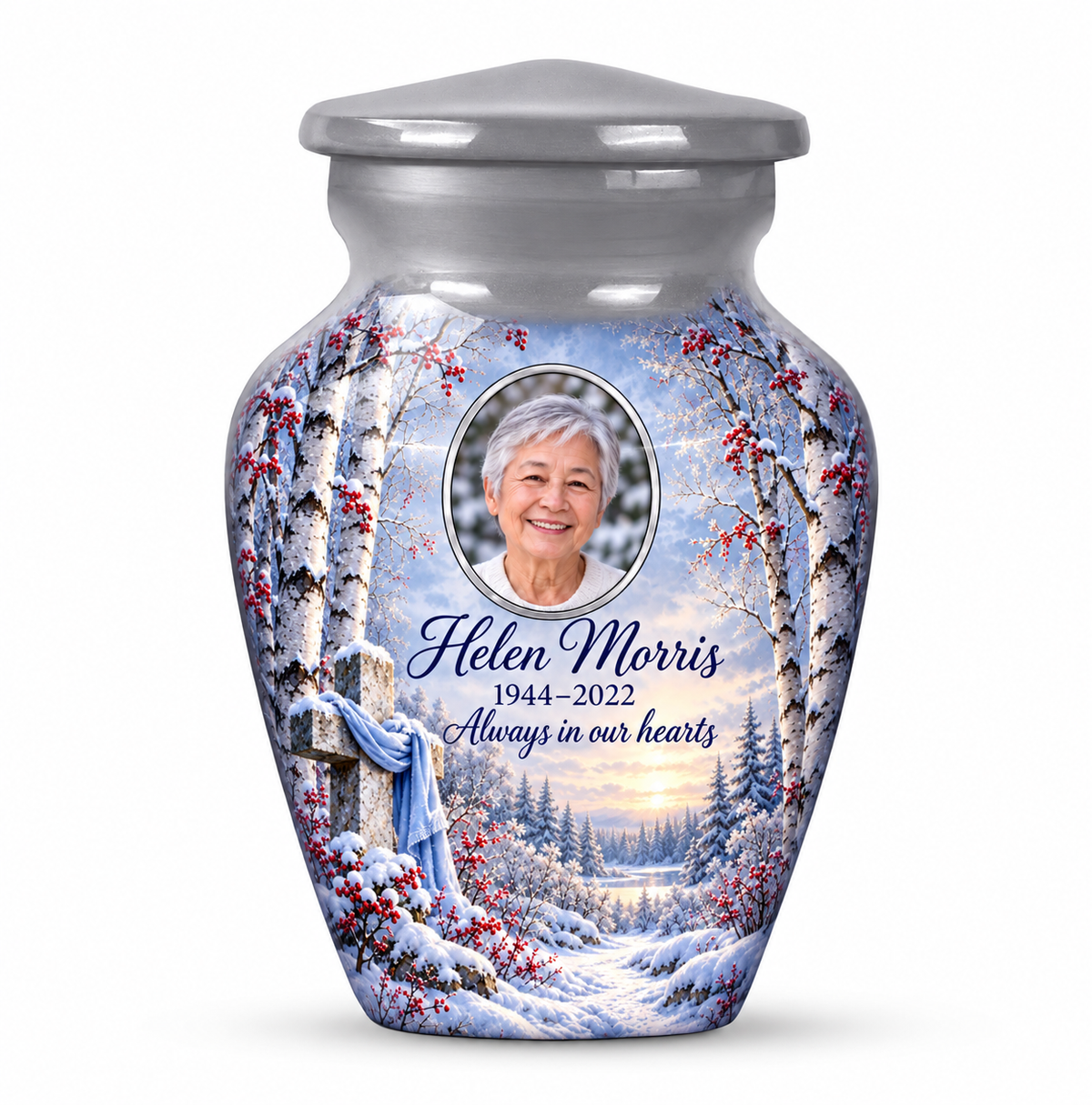 One silver cross keepsake urn with snowy birches and red berries, sample portrait and tribute on white.