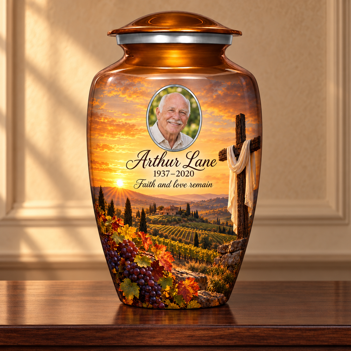 Orange adult cross urn with an amber vineyard scene displayed on a memorial console.
