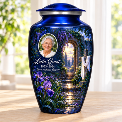 Blue adult cross urn with a blue rain garden beside a sunlit window.