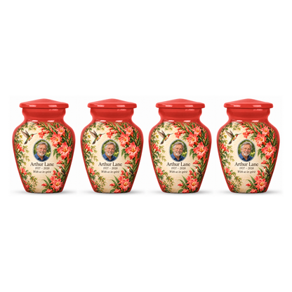 Four matching red hummingbird keepsake urns with Arthur Lane sample photo and text