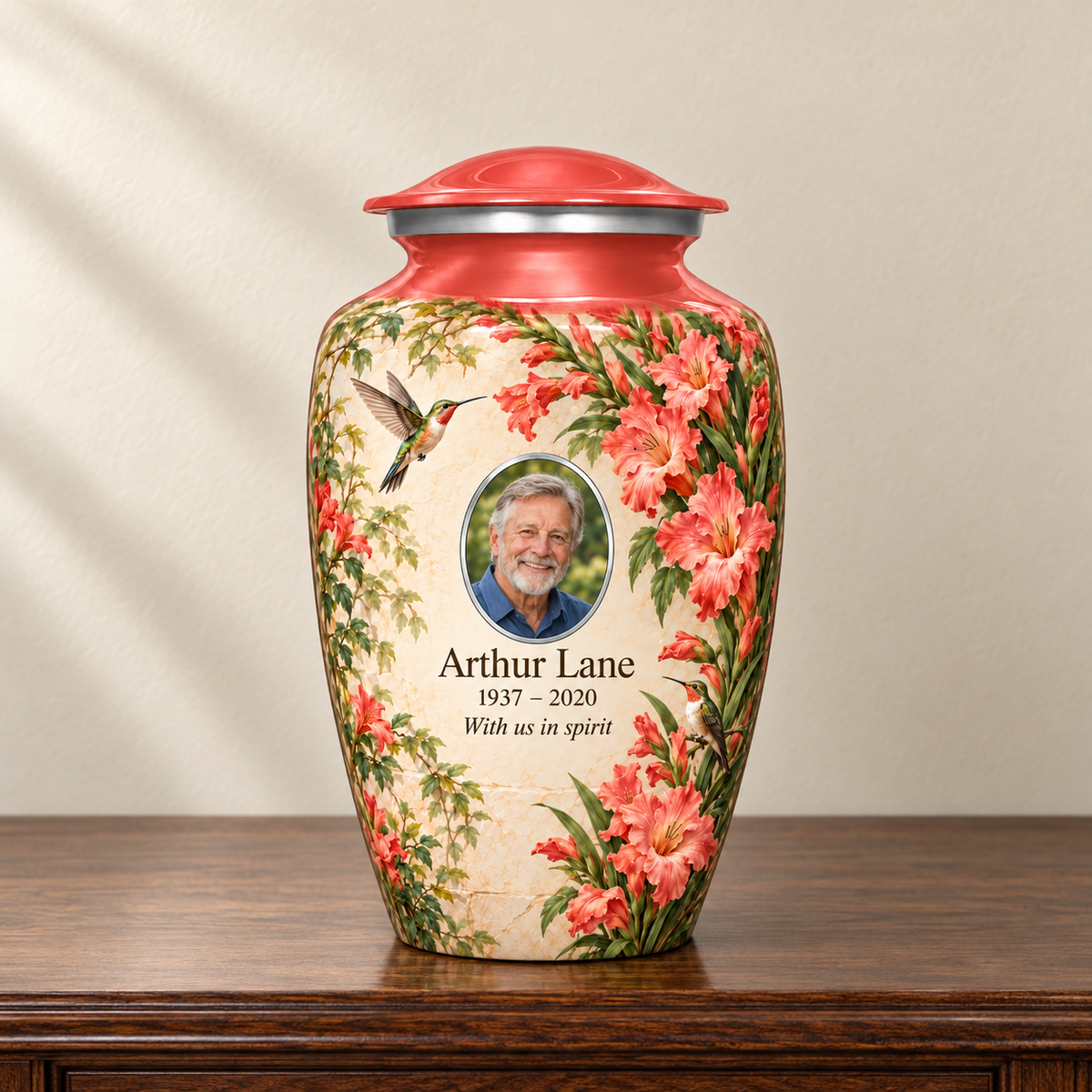 Red hummingbird adult urn with Arthur Lane sample photo and text displayed on a memorial console