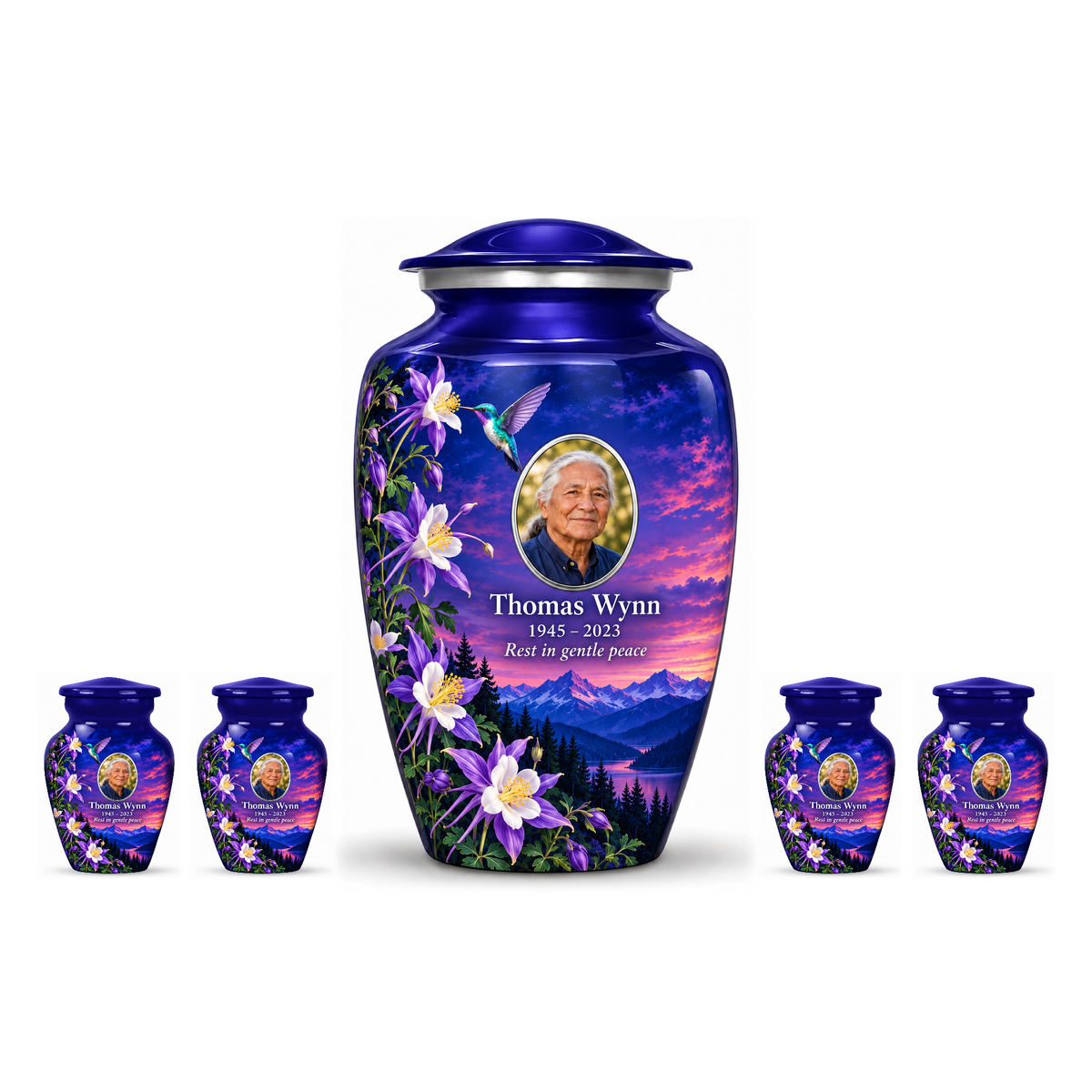 One indigo blue hummingbird adult urn centered between four matching keepsakes on white, all with Thomas Wynn sample portrait and memorial text.