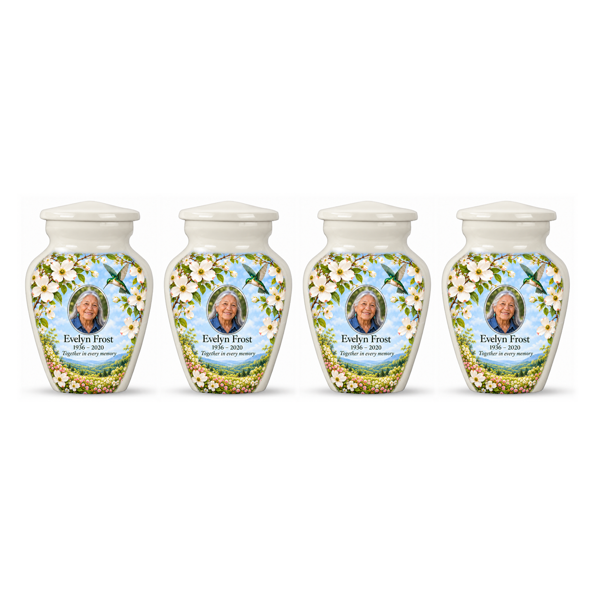 Four white hummingbird keepsake urns in a row on white, each with white dogwood artwork and Evelyn Frost sample portrait and memorial text.