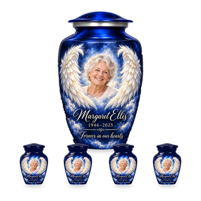 Blue adult angel wings urn with four matching keepsakes shown at proportional 10-inch and 3-inch heights.