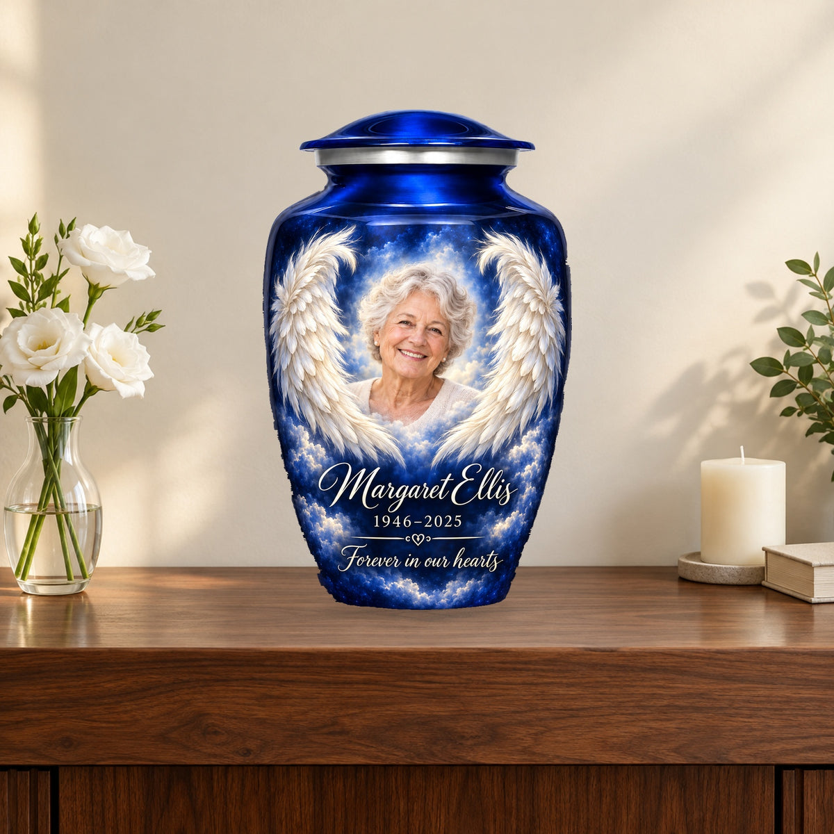 Blue adult angel wings photo urn on a memorial console.