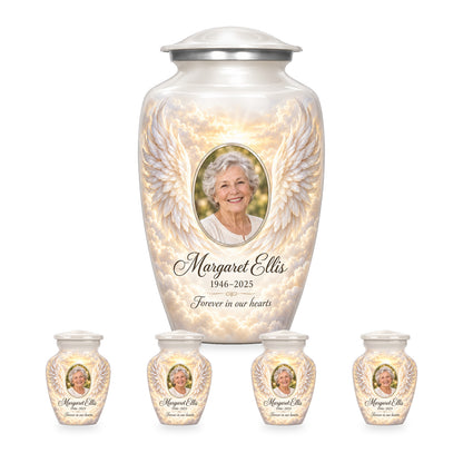 white adult angel wings urn with four matching keepsakes shown in proportional 10-inch and 3-inch sizes.