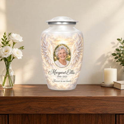 white personalized angel wings adult urn on a memorial console.