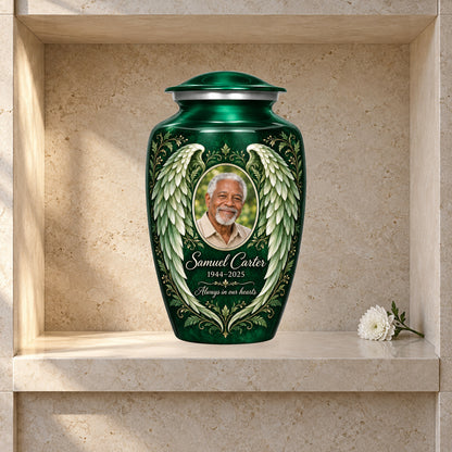 green adult urn with Botanical Wings angel wings artwork displayed in a columbarium niche.