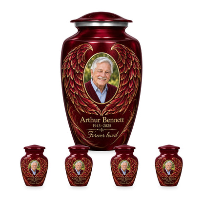 red adult angel wings urn with four matching keepsakes shown in proportional 10-inch and 3-inch sizes.