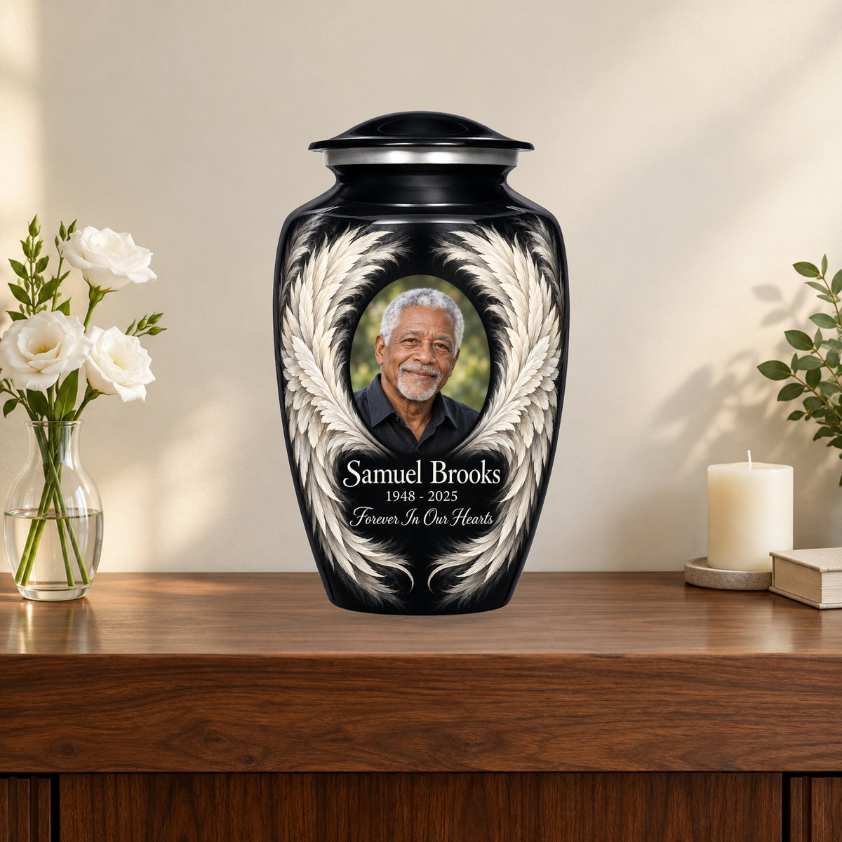 black personalized angel wings adult urn on a memorial console.