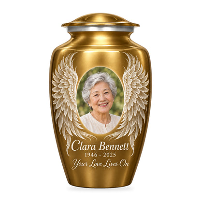 gold adult urn with Golden Etched Wings angel wings artwork, fictional sample portrait and personalized inscription on white.