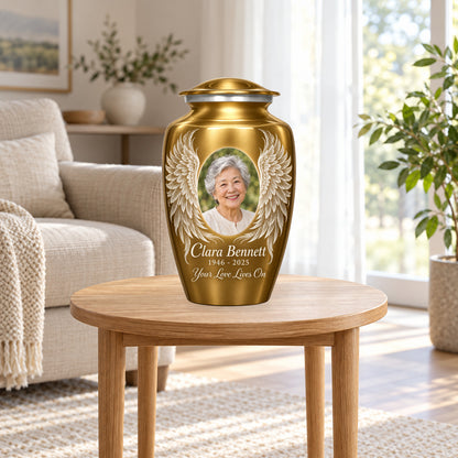 gold personalized angel wings adult urn in a sunlit home.